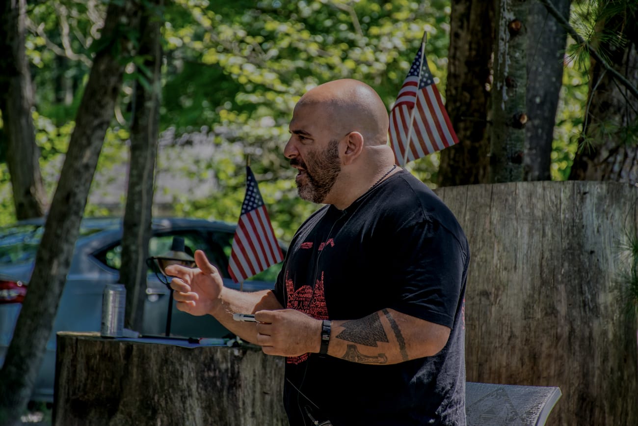 Master Chim speaking to attendees at a prior PressureCon.