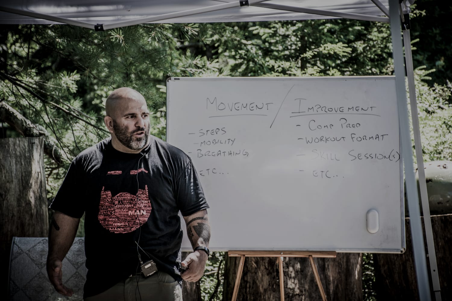 Master Chim teaching at a whiteboard during the Saturday talks at a prior PressureCon.