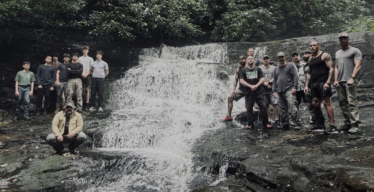 PressureCon attendees gathered at a waterfall in the Poconos at a prior event.